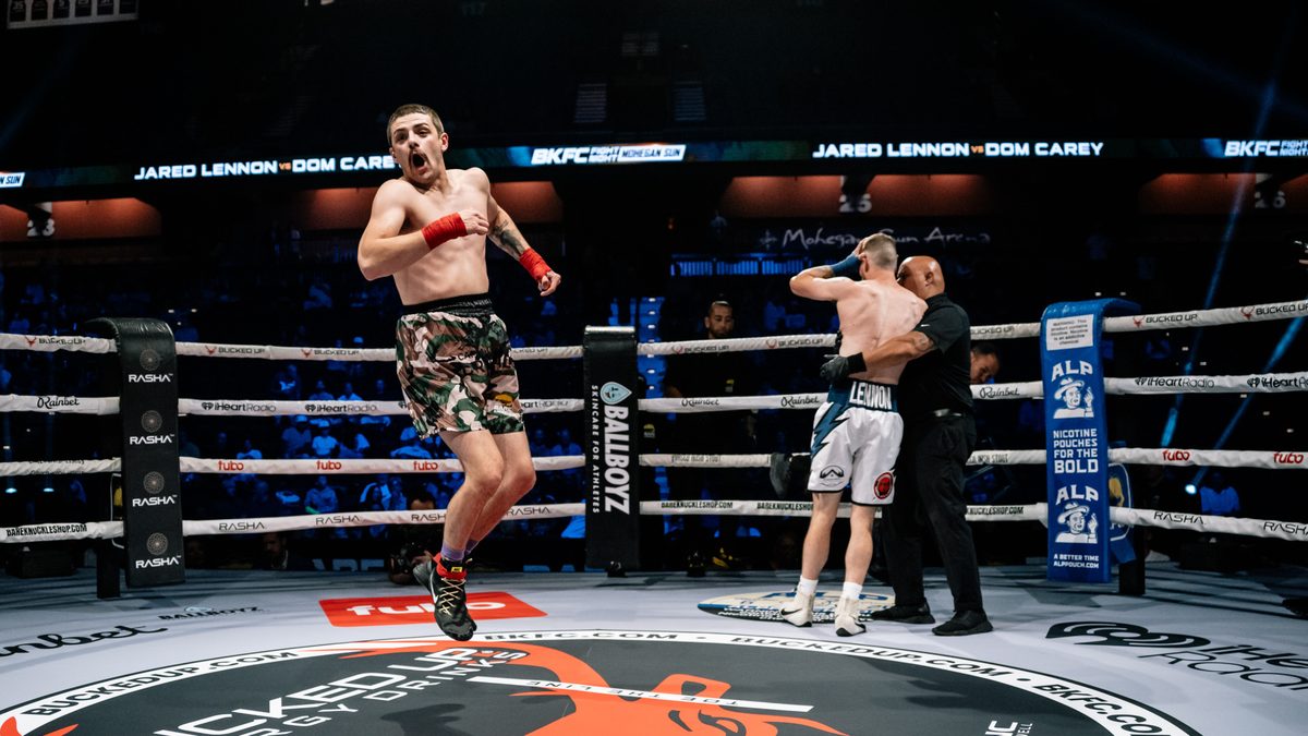 A BKFC athlete celebrates a victory inside the ring