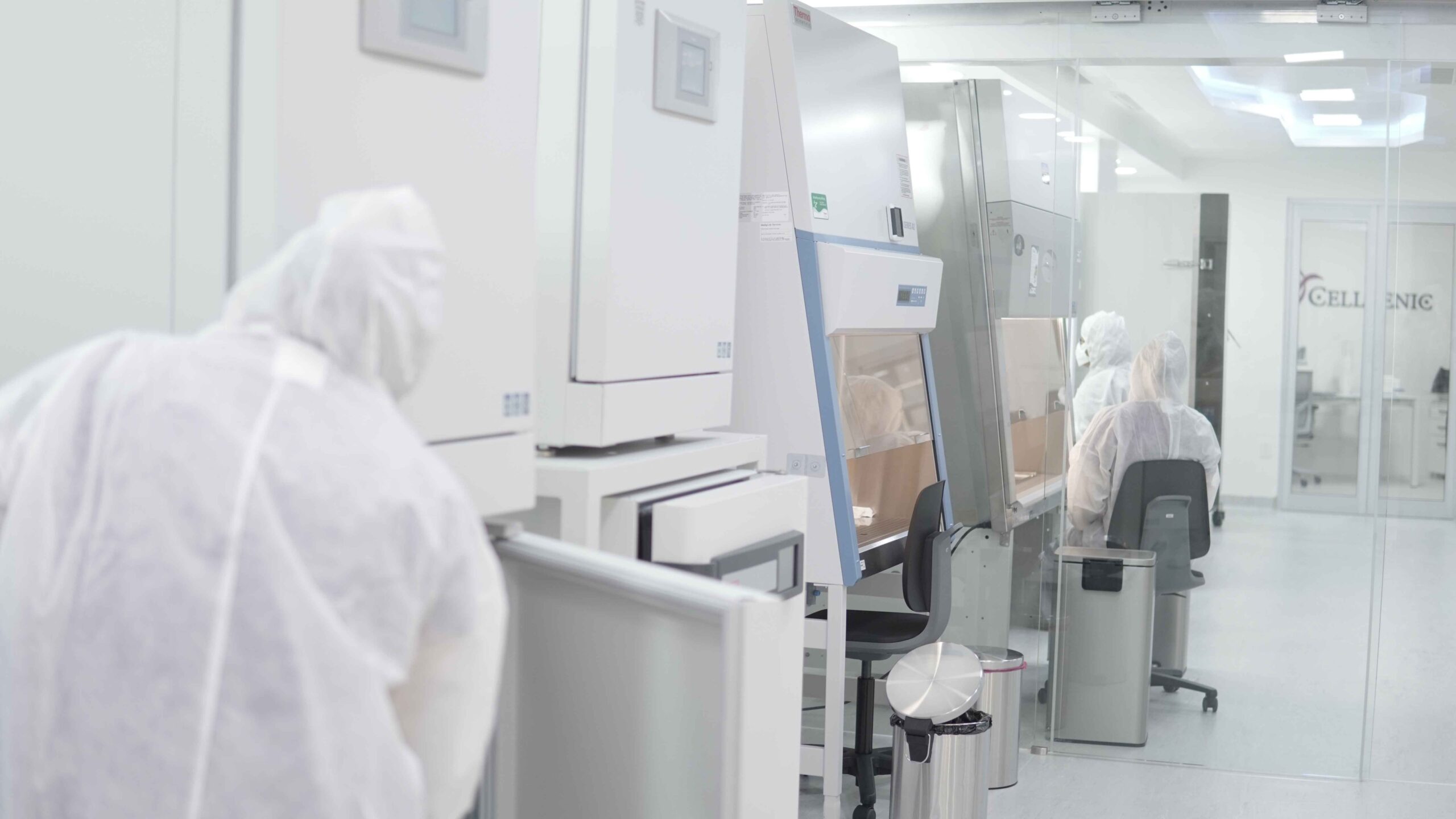 Technicians working inside the Cellgenic cGMP laboratory